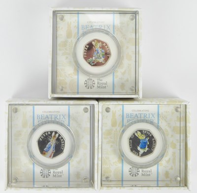 Lot 797 - THE ROYAL MINT; three silver 50 pence proof...