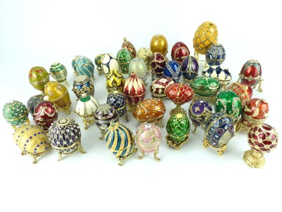Lot 174 - Approximately forty-four miniature Fabergé-style egg trinket boxes