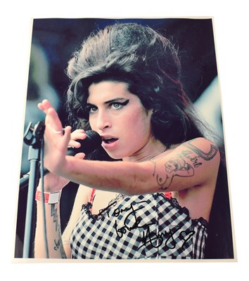 Lot 203 - AMY WINEHOUSE; a colour promotional photograph...