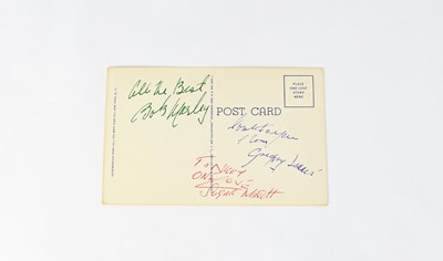Lot 222 - BOB MARLEY; a postcard bearing the signatures...