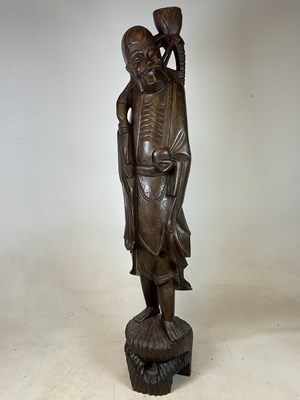 Lot 231 - A large 20th century Chinese carved wooden...