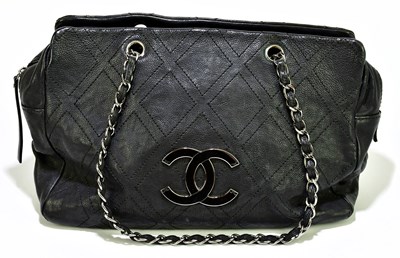 Lot 657 - CHANEL; a black CC diamond stitch calf skin...