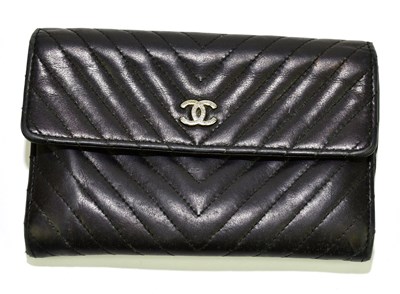 Lot 601 - CHANEL; a black lamb skin leather Chevron...