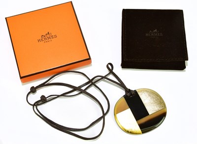 Lot 580 - HERMÈS; a 'Horn and Lacquer Line' round...
