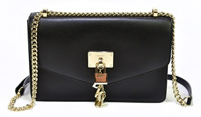 Lot 672 - DKNY; an unused with original tags black...