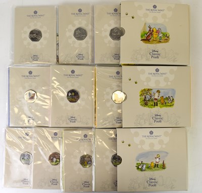Lot 746 - THE ROYAL MINT; three Disney Winnie-the-Pooh...