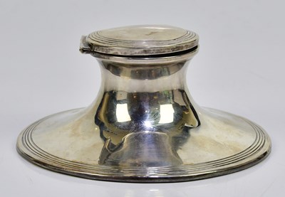 Lot 2077 - A white metal weighted ink well, with small...