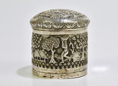Lot 2078 - A white metal Eastern lidded jar decorated...