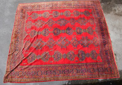 Lot 2322 - A large hand knotted carpet with geometric...