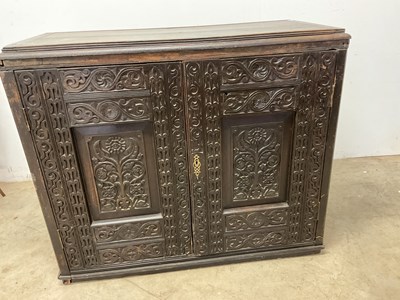 Lot 2531 - A late 17th century oak cabinet, the twin...