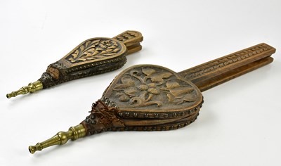 Lot 1450 - Two pairs of carved oak hand bellows, largest...