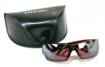 Lot 625 - CHANEL; a pair of red wrap around sunglasses...