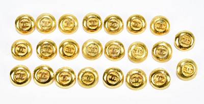 Lot 647 - CHANEL; twenty-four gold tone stamped Chanel...