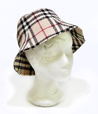 Lot 648 - BURBERRY; a beige, black, cream and red plaid...