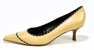 Lot 805 - CHANEL; a pair of unused and unworn cream calf...