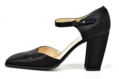 Lot 784 - CHANEL; a pair of black satin shoes with...