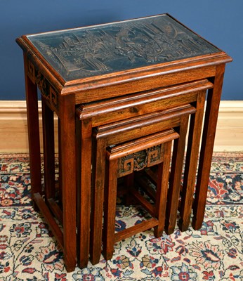 Lot 1823 - A nest of four Chinese carved hardwood tables,...