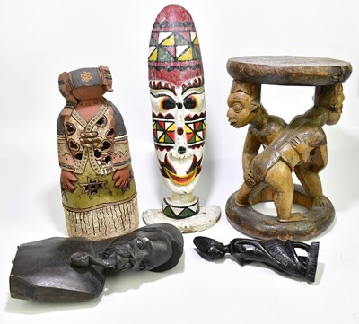 Lot 1839 - Three wooden figures, together with a further...