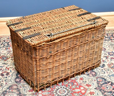 Lot 2030 - A wicker laundry basket, with metal straps,...