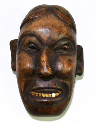 Lot 1837 - A hard wood carved wooden wall mount, with...