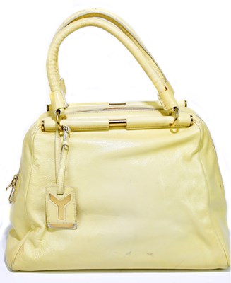 Lot 695 - YVES SAINT LAURENT; a large lemon yellow...