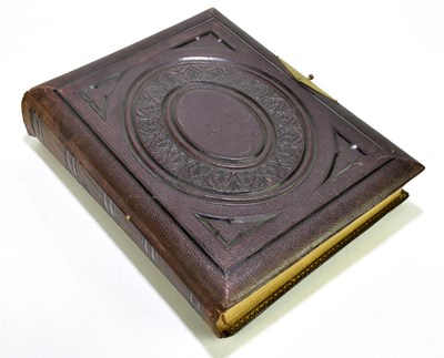 Lot 1493 - A Victorian photograph album to include...