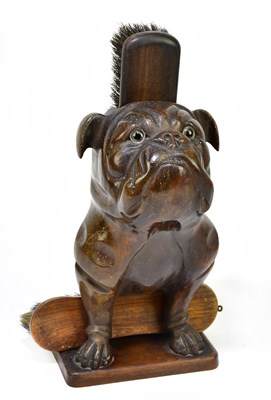 Lot 2026 - A decorative Black Forest brush hold modelled...