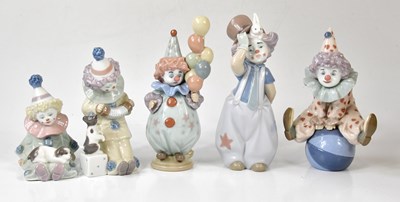 Lot 1416 - LLADRO; five assorted clown figures to include...