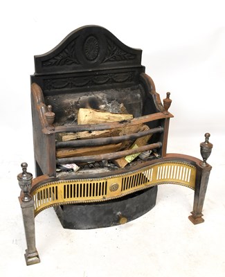 Lot 1416 - A cast iron and brass fire grate with cast...