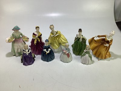 Lot 1746 - ROYAL DOULTON; a group of nine figures, to...