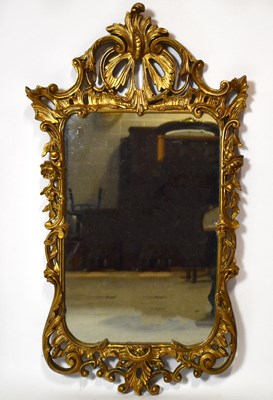 Lot 1457 - A reproduction decorative gilt framed wall...