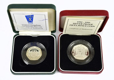 Lot 1473 - Two cased proof 50p pieces with certificates (2)