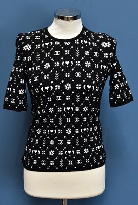 Lot 730 - CHANEL; an unused with original tags short...