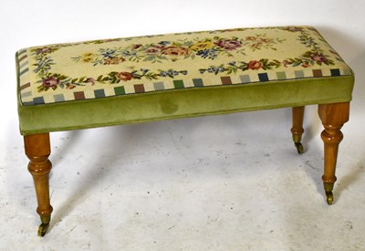 Lot 1749 - A reproduction long footstool with needlework...