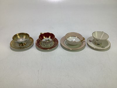 Lot 1686 - Four tea cups and saucers, to include a...