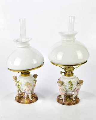 Lot 1587 - A pair of Sitzendorf painted oil lamps with...