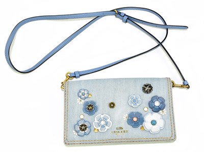 Lot 696 - COACH; a calf skin and soft leather and light...