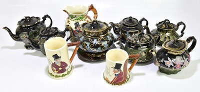 Lot 1524 - A collection of seven Jackfield teapots, one...