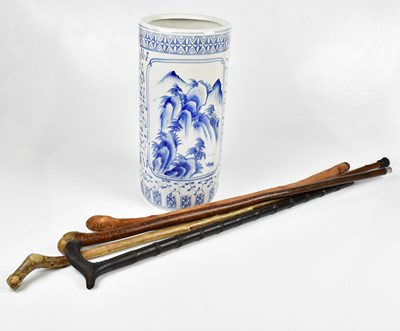 Lot 1034 - Two unusual walking canes with carved heads,...