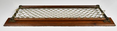 Lot 1060 - A mahogany and rope train luggage wall mounted...