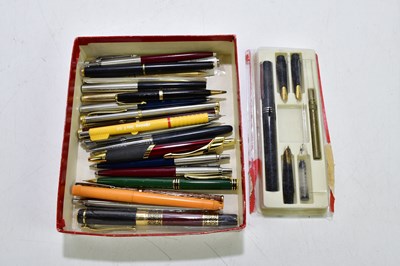 Lot 2055 - A small collection of fountain pens, ballpoint...