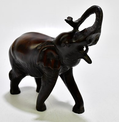 Lot 1831 - A resin figure of an elephant, height 22cm.