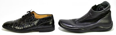Lot 801 - PRADA; a pair of soft leather flat ankle boots...