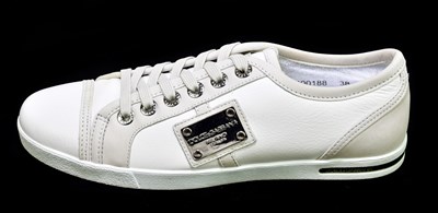 Lot 797 - DOLCE & GABBANA; a pair of unused white flat...