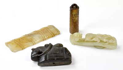 Lot 2049 - A hardstone belt buckle, together with three...