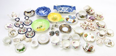 Lot 818 - A collection of miniature porcelain and...