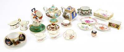 Lot 834 - A collection of miniature ceramics and...