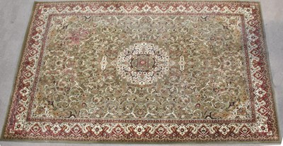 Lot 2660 - A large machine woven Persian carpet with...