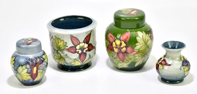 Lot 1772 - MOORCROFT; four pieces, decorated in the 'Arum...