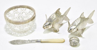 Lot 1329 - Two white metal articulated models of fish,...